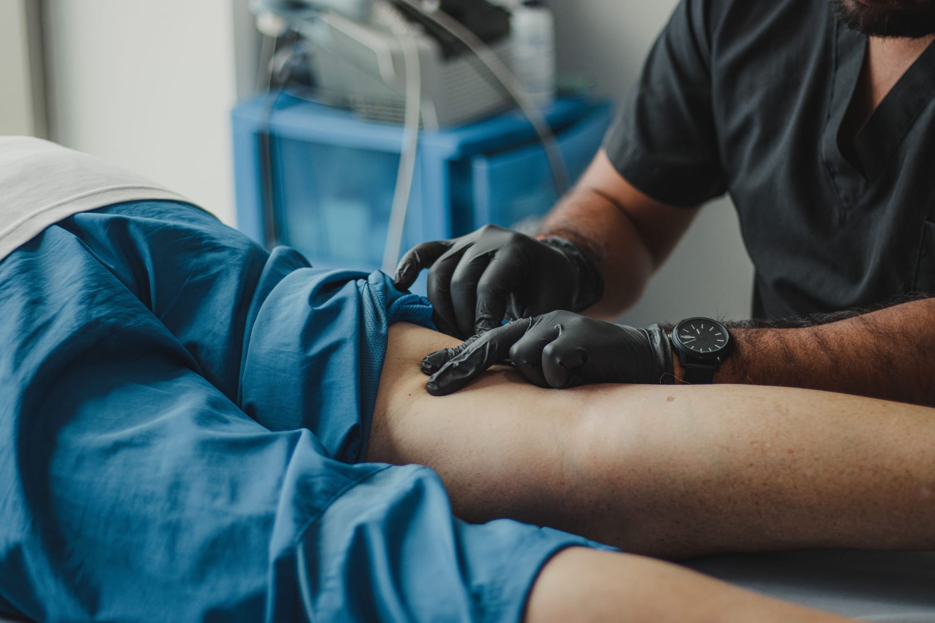 Doctor checking patient blood pressure
